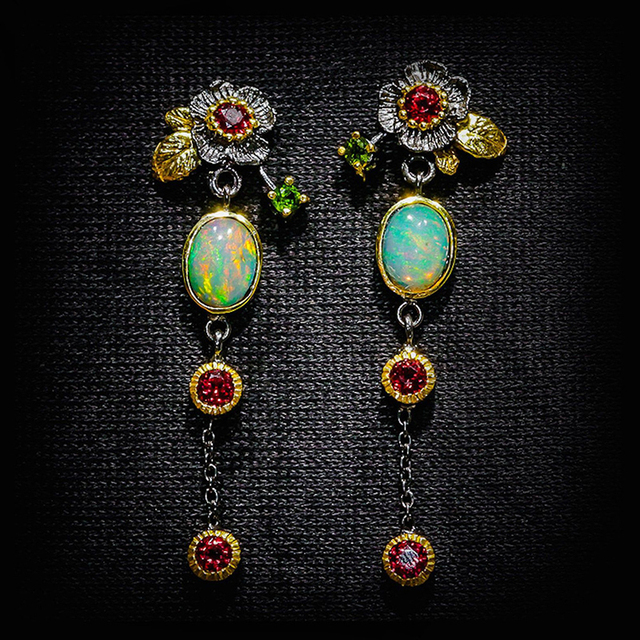 Women's Bohemian drop earrings with radiant opal and sparkling red zirconia. Handcrafted statement jewelry.
