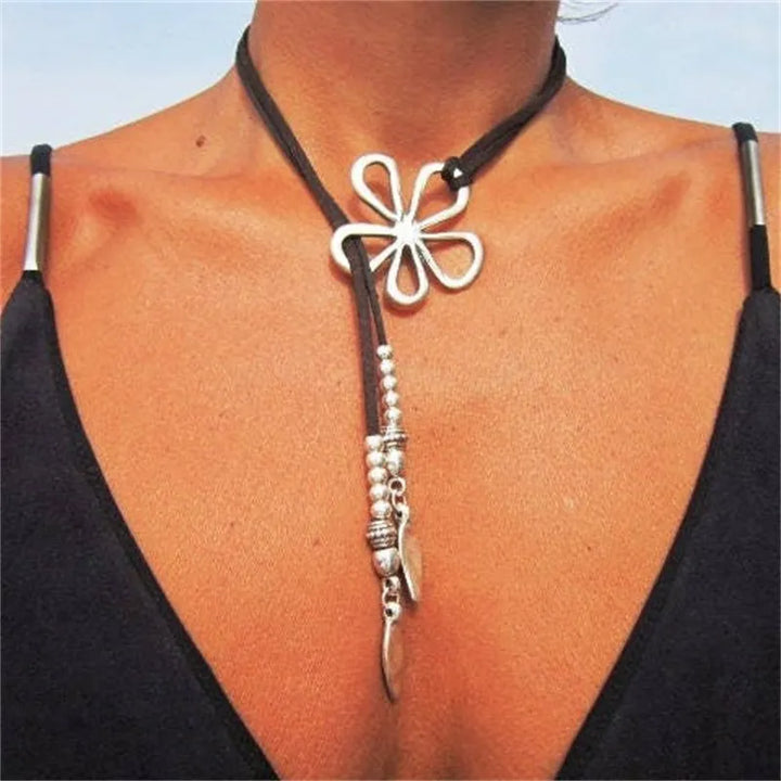 Women's Bohemian floral pendant necklace, ethnic style. Stainless steel fashion accessory.