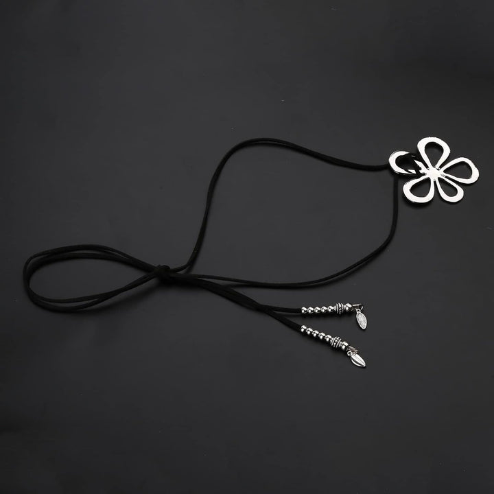 Unique women's bohemian necklace with floral pendant. Ethnic style statement jewelry.