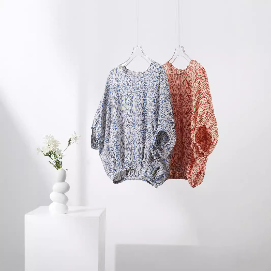 Unique bohemian women's floral print pullover top. Long balloon sleeves for a relaxed, stylish fall/spring look.