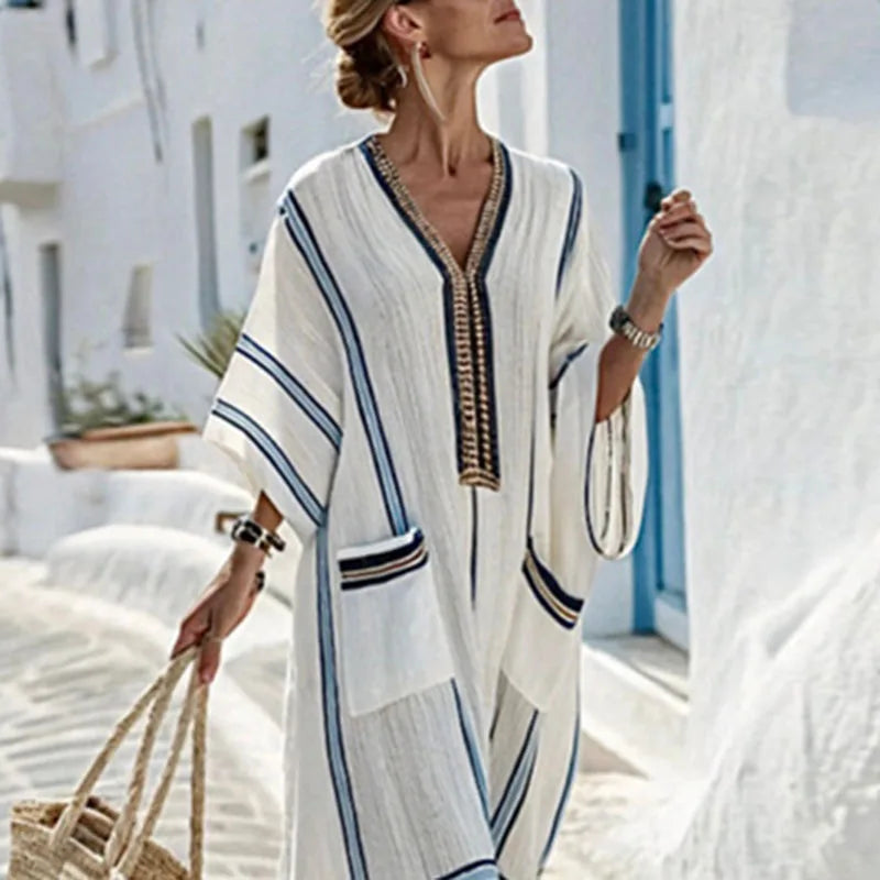 Flowy bohemian maxi dress with kimono sleeves & pockets, ideal women's summer beachwear or vacation outfit.