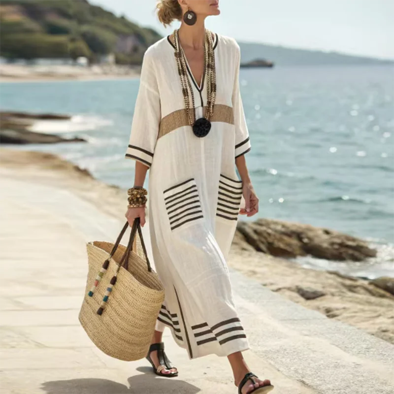 Stylish women's bohemian flowy maxi dress with pockets, designed for beach, resort, or casual summer wear.