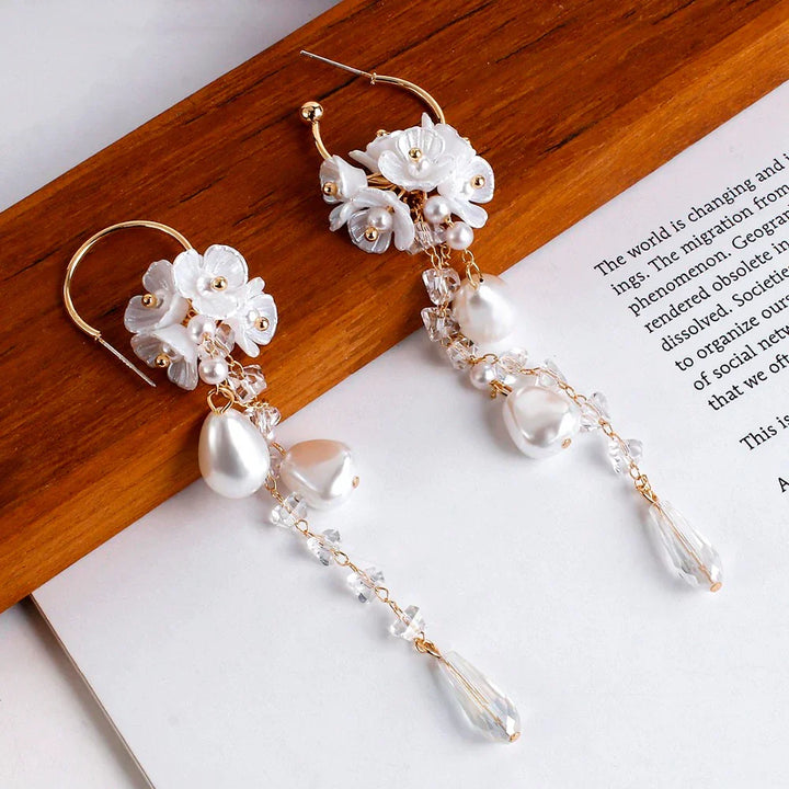 Elegant women's Bohemian dangle earrings with lustrous pearls and sparkling crystals.