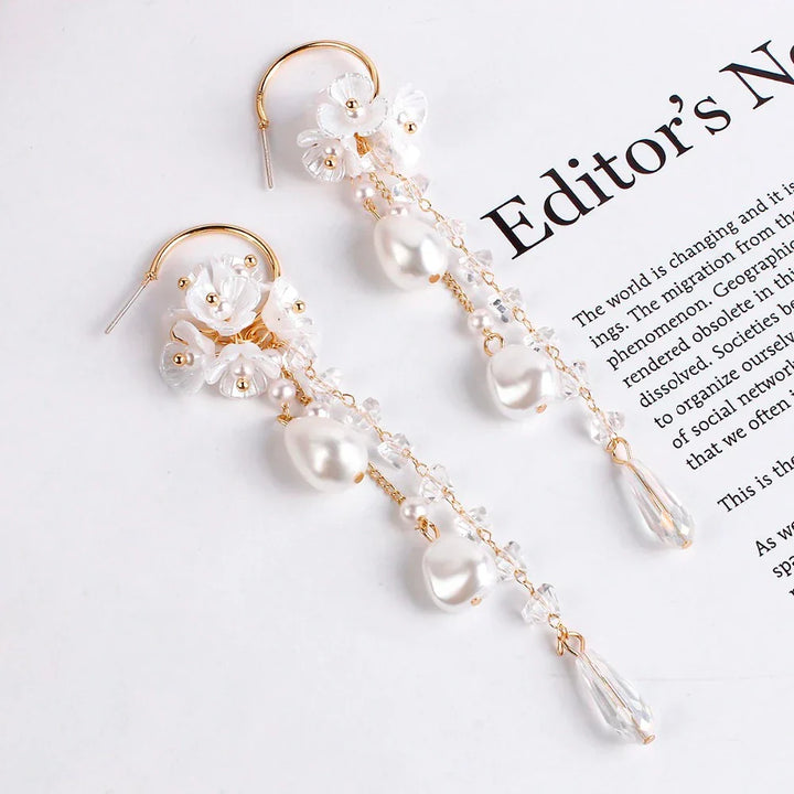 Intricate women's Bohemian dangle earrings featuring freshwater pearls & clear crystals.