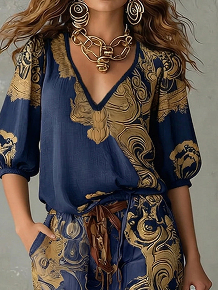 Stylish women's bohemian print matching outfit: v-neck top with half sleeves & coordinating relaxed fit pants.