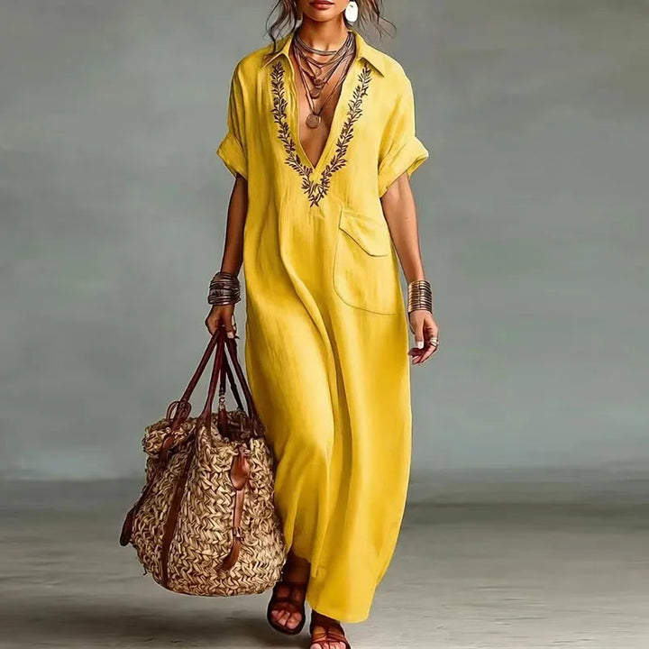 Elegant women's summer maxi dress with a bohemian print & deep V-neck. Ideal for beach days & resort wear.