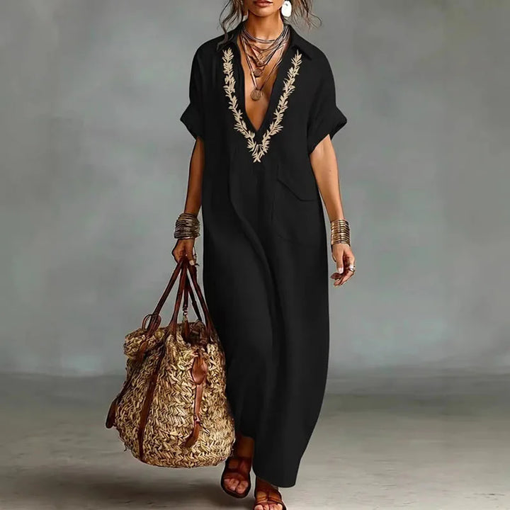 Plus size women's bohemian printed maxi dress with deep V-neck. Flowy and comfortable for casual wear.