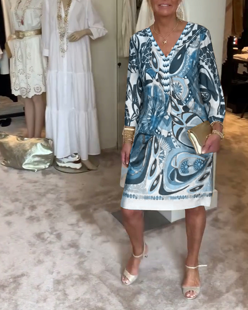 Versatile women's Bohemian sunburst printed tunic dress, a colorful V-neck for summer, casual or resort.