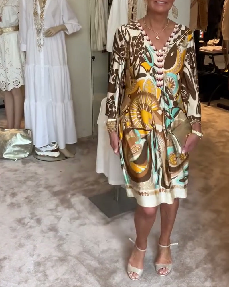 Lightweight, flowy Bohemian tunic dress for women, boasting a beautiful sunburst abstract print for summer.