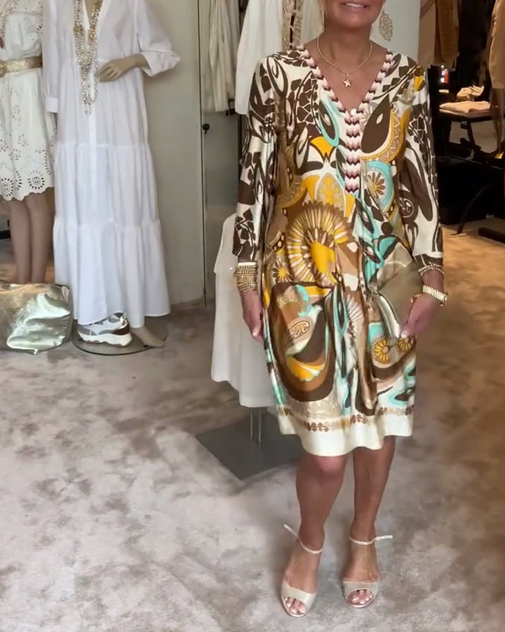 Lightweight, flowy Bohemian tunic dress for women, boasting a beautiful sunburst abstract print for summer.