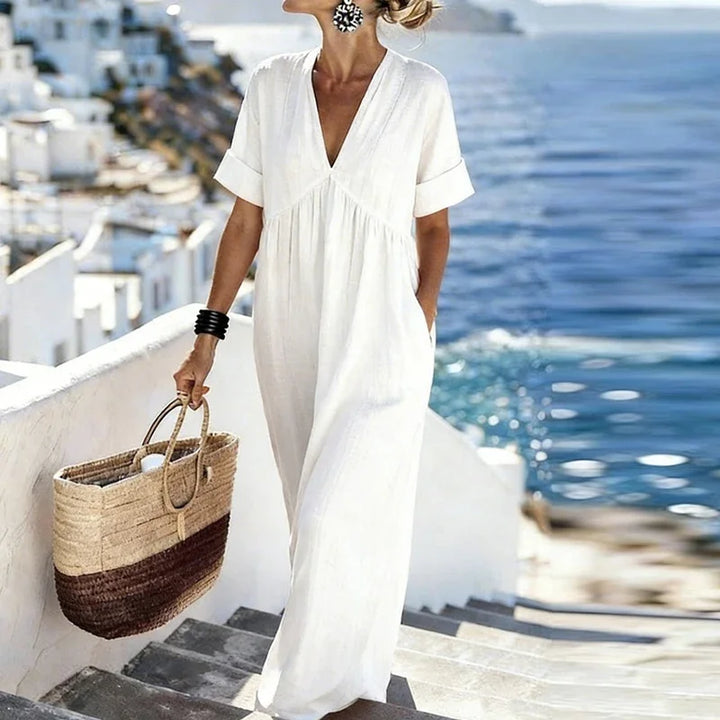 Casual V-neck maxi dress for women, featuring a bohemian style & practical pockets. Great for summer & travel.