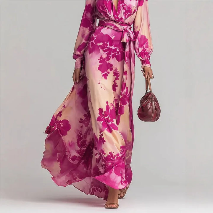 Flowy women's bohemian maxi dress with a deep V-neck, long lantern sleeves, and a belted waist for summer style.