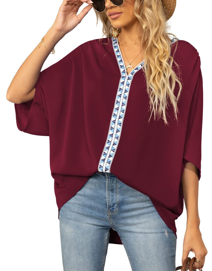 Relaxed fit women's tunic blouse, featuring a V-neck and vibrant bohemian geometric print.