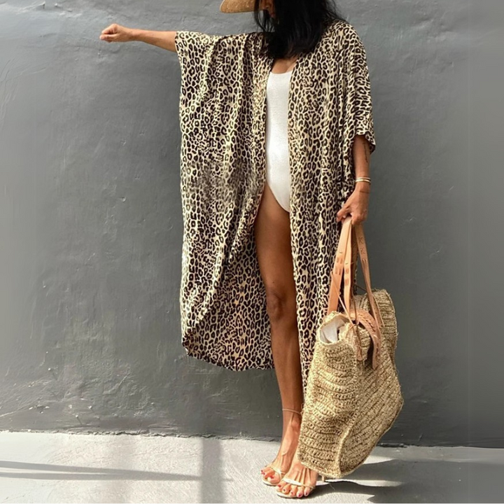 Leopard print women's boho blouse, relaxed fit with elegant kimono sleeves, great for beach fashion.