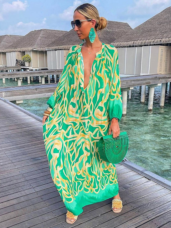 Women's Boho Breeze Maxi Dress, vibrant print, flowy summer vacation dress for beachwear or casual style.