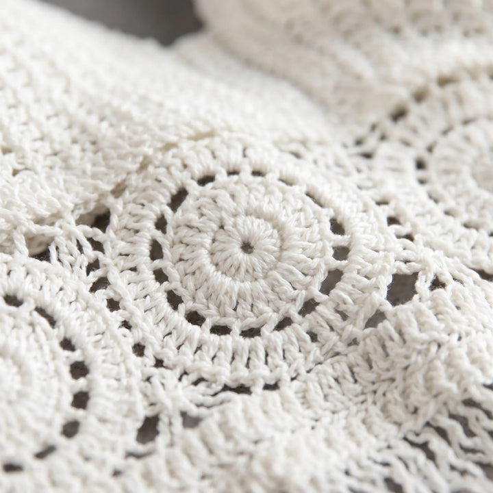 Boho women's crochet halter crop top with open back, ideal summer festival and beachwear.