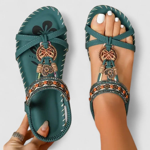 Summer women's boho sandals with detailed ethnic embroidery. Casual and stylish flat footwear.