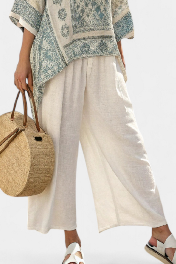Artisan floral print women's boho batwing blouse and wide-leg pant set. Stylish, relaxed fit for spring & summer outfits.