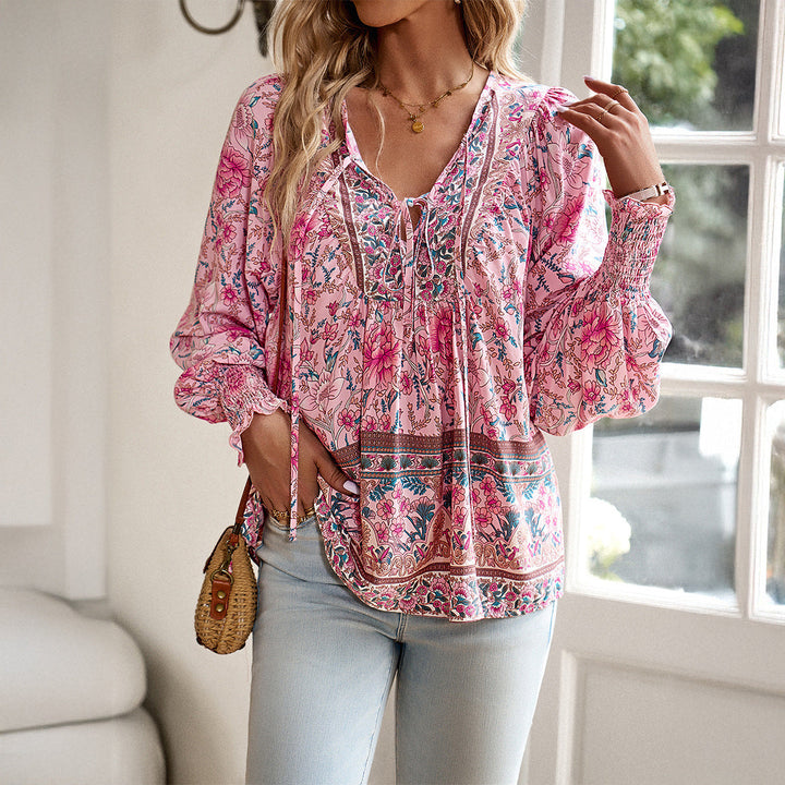 Women's boho floral blouse with puff sleeves & V-neck. Loose, stylish top for everyday or vacation.