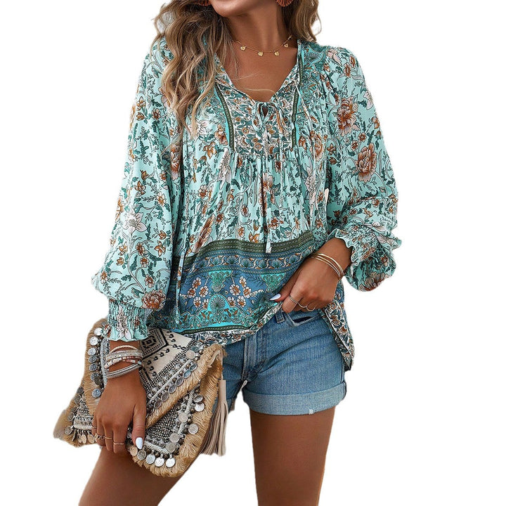 Casual chic women's floral boho blouse. Loose fit, V-neck, puff sleeves. Stylish top for summer & everyday.