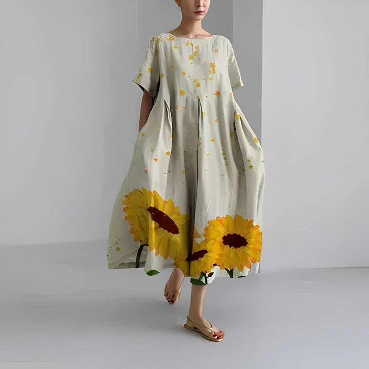 Beautiful women's summer boho maxi dress with vibrant floral patterns. Perfect for beach or vacation.