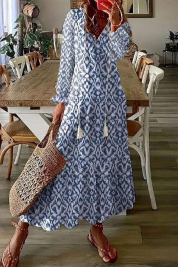 Elegant women's boho floral maxi dress with tassel V-neck, a stylish choice for summer, beach, or festivals.