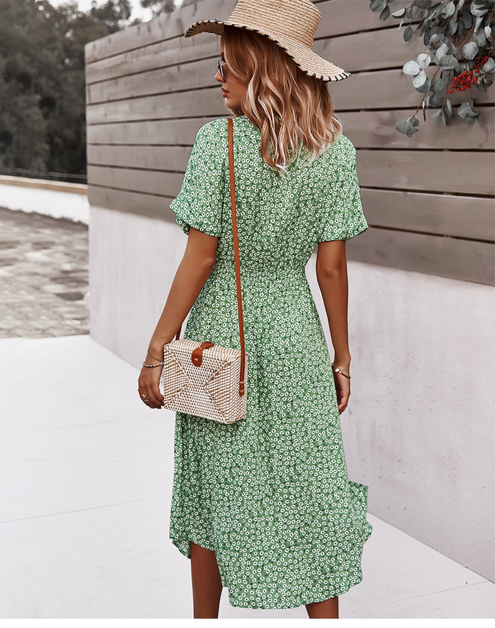 Flowy women's boho floral midi dress, V-neck, button details. A comfortable and elegant choice for summer fashion.
