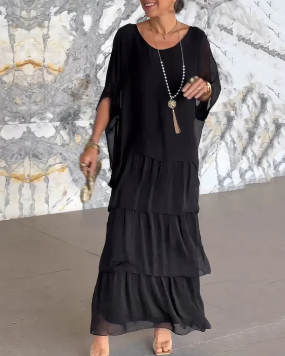 Vacation-ready women's boho maxi dress set, featuring a layered skirt and stylish batwing top.