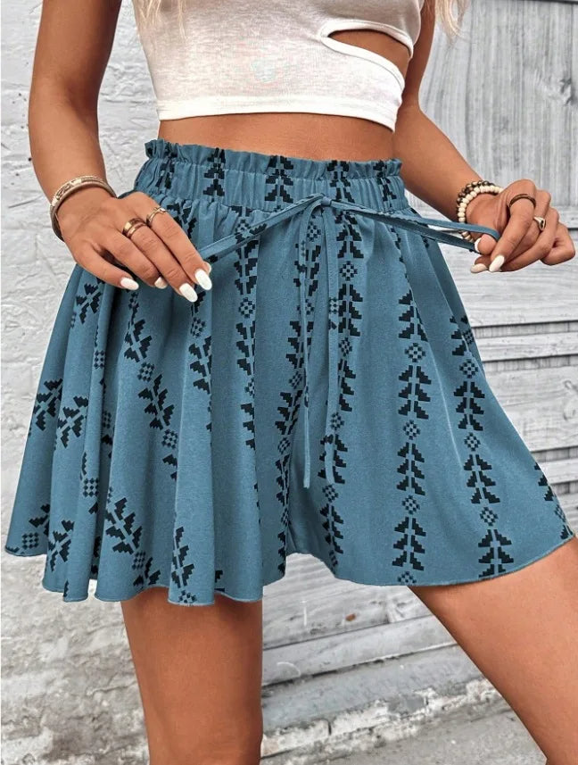 Women's high-rise smocked waist shorts, geometric print, boho flare, comfortable summer style.