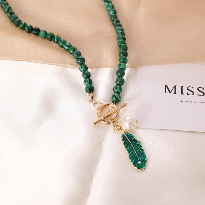 Elegant women's necklace with natural malachite gemstones & lustrous pearls. Boho spiritual healing jewelry.