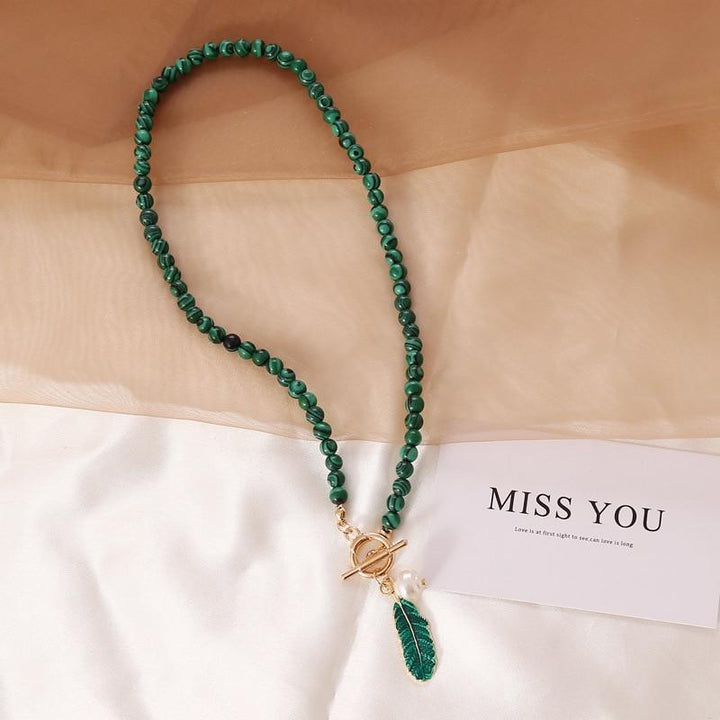 Malachite & pearl aura necklace for women. Bohemian spiritual healing gemstone jewelry, perfect for any occasion.