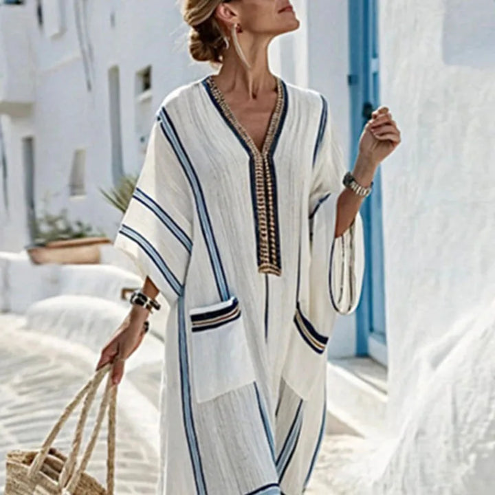 Flowing women's boho striped maxi dress, ideal casual resort wear or a chic vacation outfit with a V-neck.