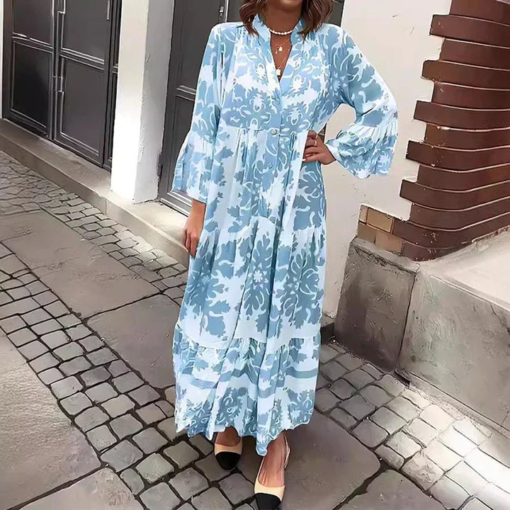 Flowy women's baroque print maxi dress with tiered skirt, lantern sleeves, and button-down boho style.