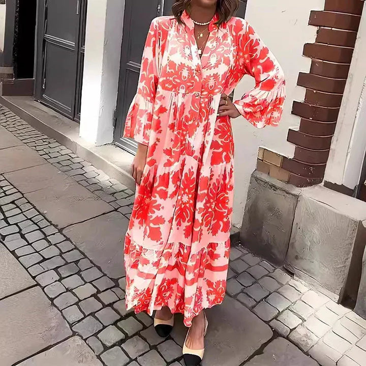 Stylish women's summer vacation maxi dress featuring a vibrant baroque print, lantern sleeves, and buttons.