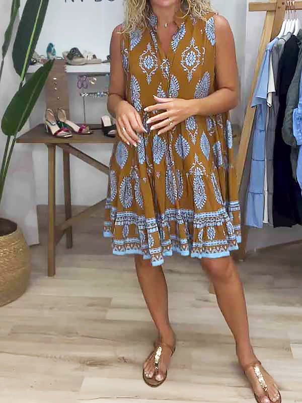 Women's boho medallion print smock mini dress with ruffle hem. Perfect sleeveless summer vacation wear.
