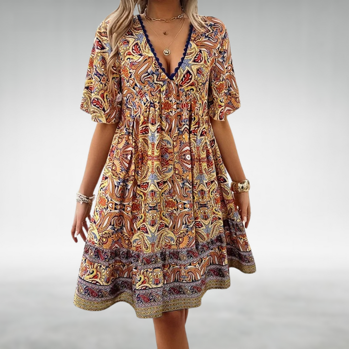 Women's boho mini dress with colorful paisley print, short sleeves & flowy design, perfect for summer casual wear.