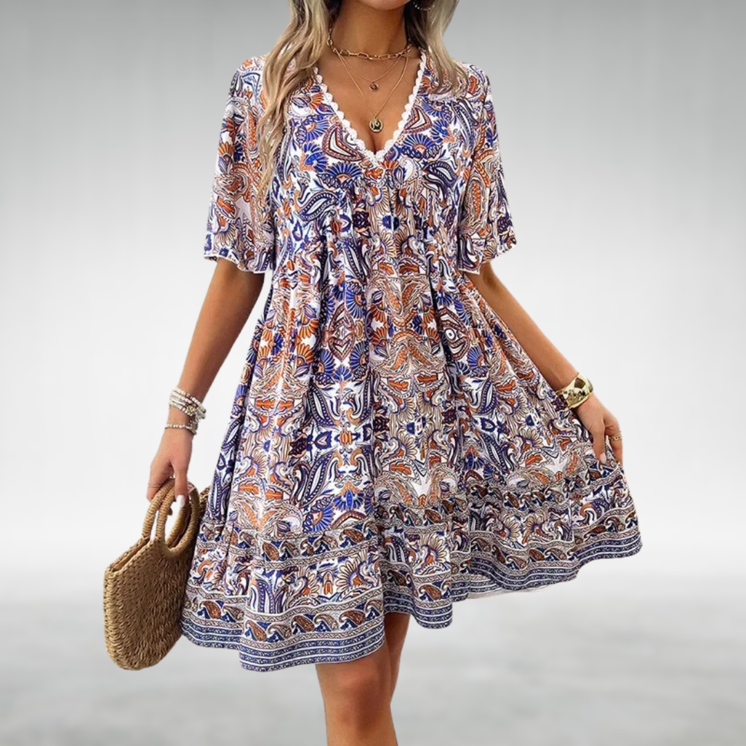 Colorful women's bohemian mini dress with eye-catching paisley pattern & comfy short sleeves for a relaxed look.