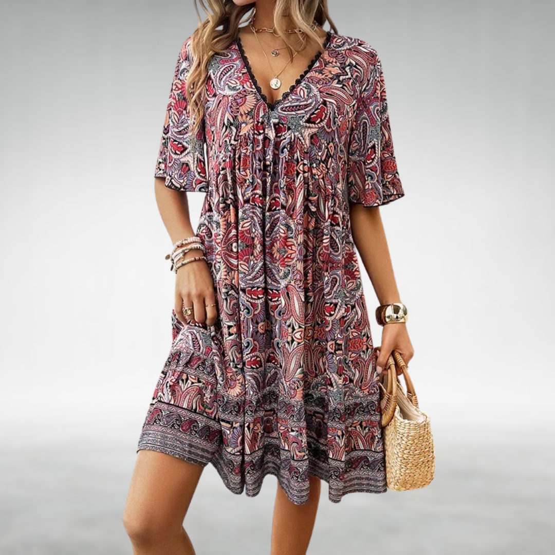 Stylish women's short sleeve boho mini dress with intricate paisley print, a chic choice for summer fashion.