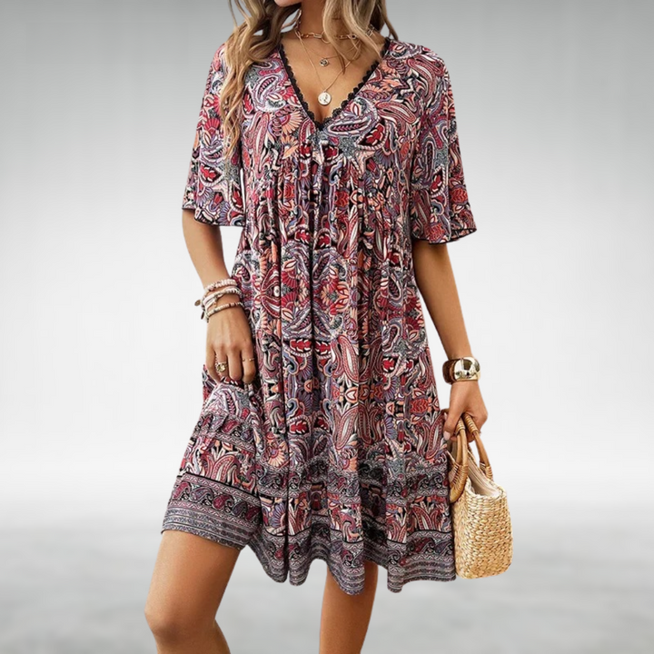 Stylish women's short sleeve boho mini dress with intricate paisley print, a chic choice for summer fashion.