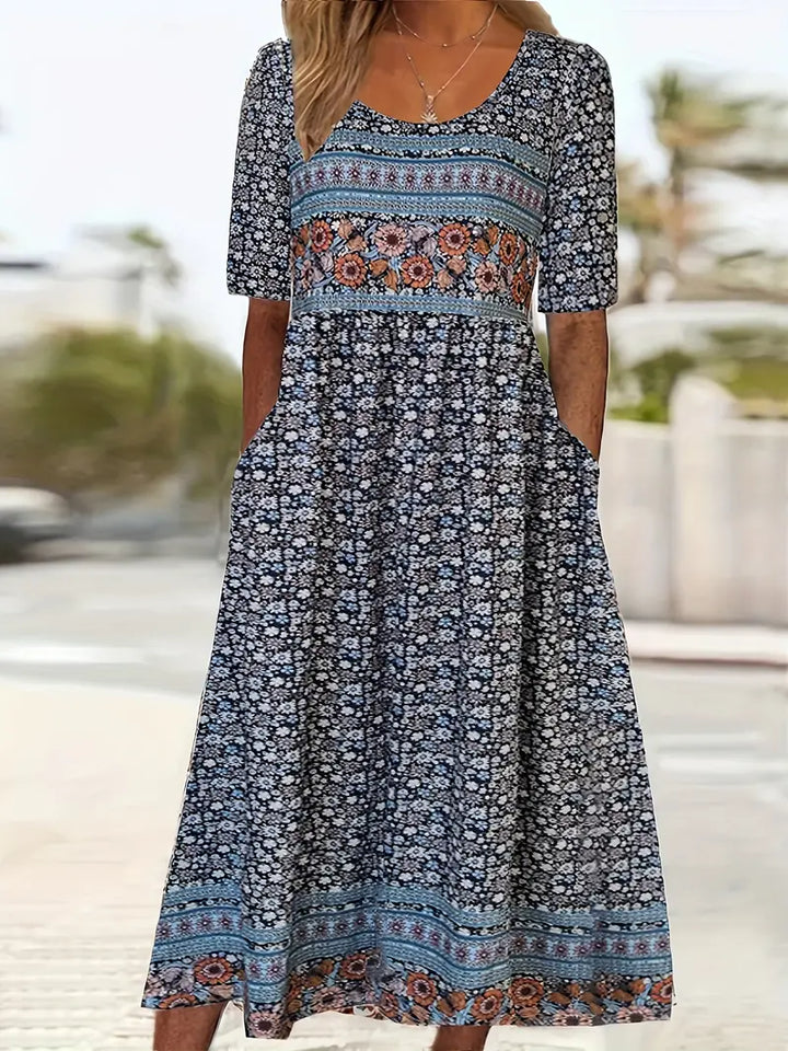Flowy women's boho print midi dress with round neck & gathered waist, ideal for casual summer outings or vacation.