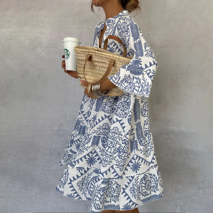 Women's boho print swing midi dress with V-neck, 3/4 sleeves, and flowy A-line cut. Perfect for summer.