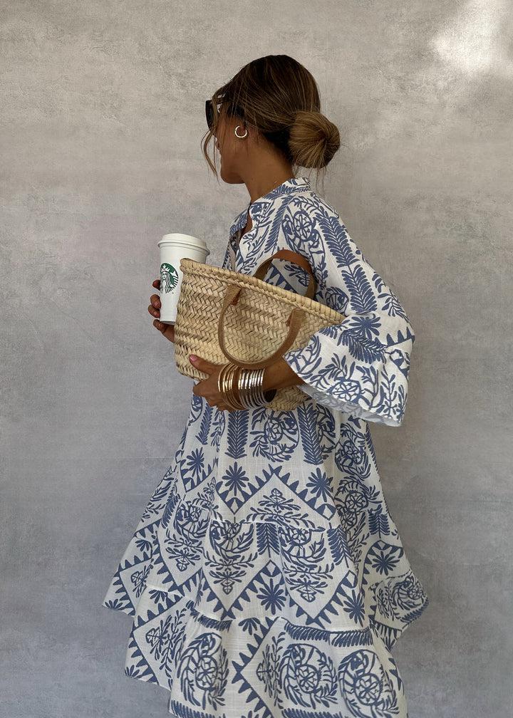 Women's midi A-line boho print dress with a flattering V-neck, 3/4 sleeves, and a comfortable flowy fit.