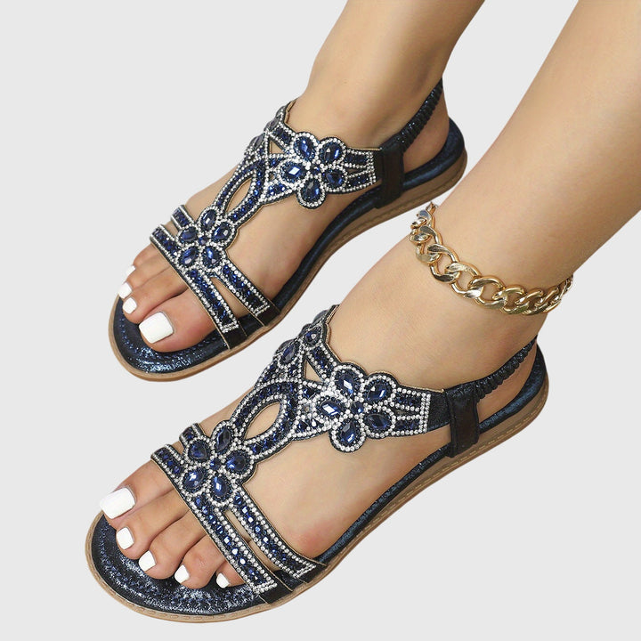 Shimmering women's Boho flat sandals with comfort-focused design.