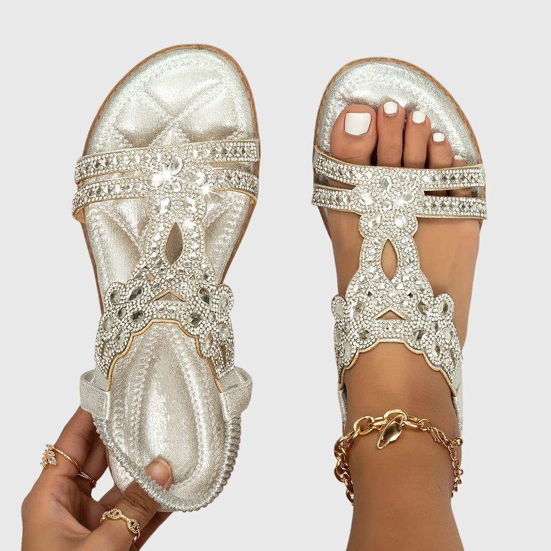 Embellished women's flat sandals for resort and vacation wear.