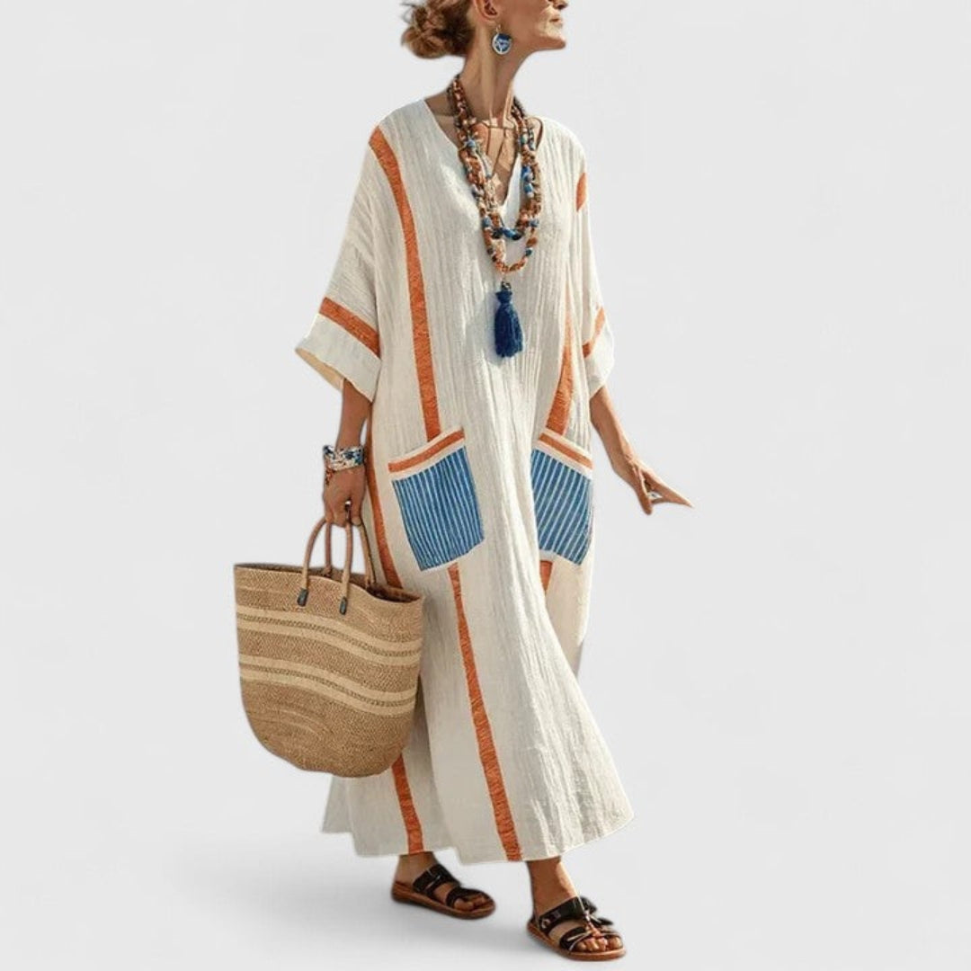 Comfortable loose-fit women's striped maxi kaftan dress with V-neck & pockets, perfect for casual summer wear.