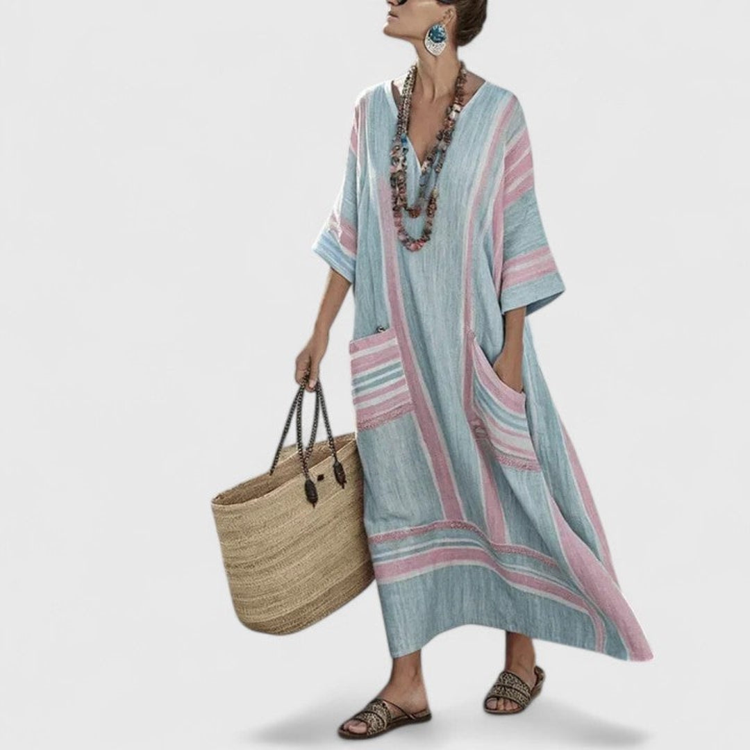Stylish women's striped maxi kaftan dress in a loose boho style, featuring a V-neck and practical pockets.