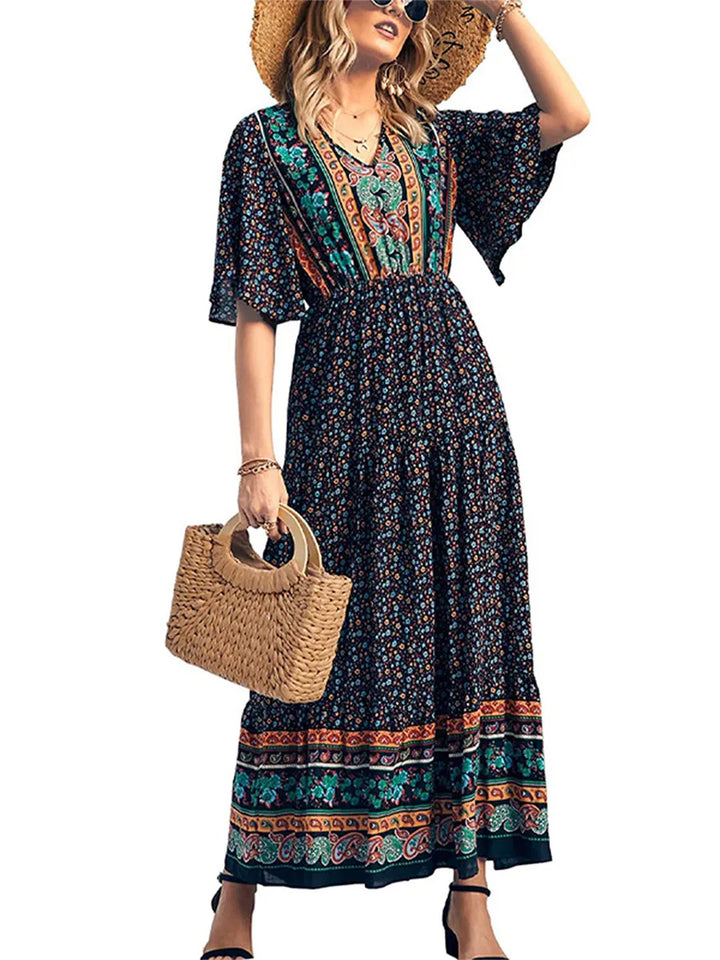 Elegant women's summer boho dress, radiant flowing short sleeve V-neck, perfect for vacation.