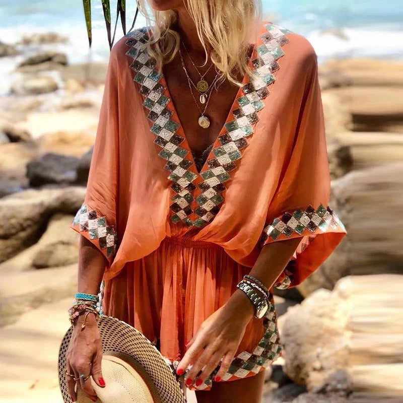 Stylish women's flowy V-neck boho romper, comfortable summer outfit for resort wear, beach days, or casual outings.