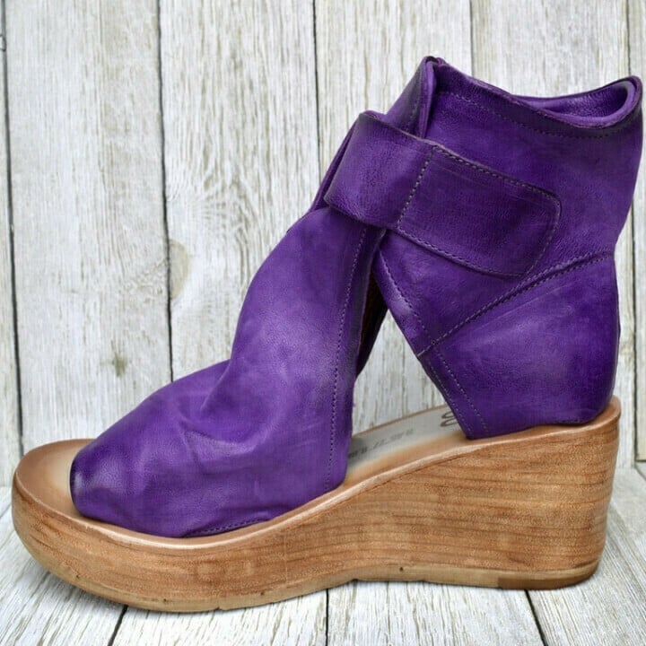 Close-up of women's boho wedge sandals, showcasing comfortable orthopedic sole and detailed straps.