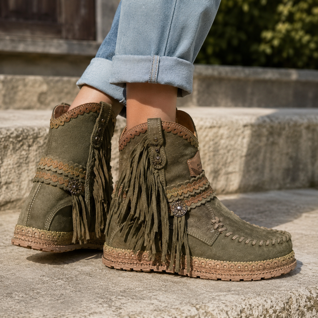Stylish women's boho western ankle boots with fringe; comfortable slip-on design for travel.